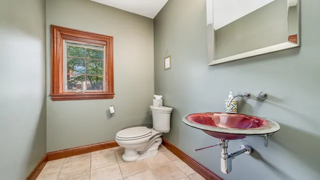 a bathroom with a granite countertop sink a mirror and a shower