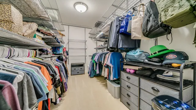 a bathroom with a shower curtain and a window