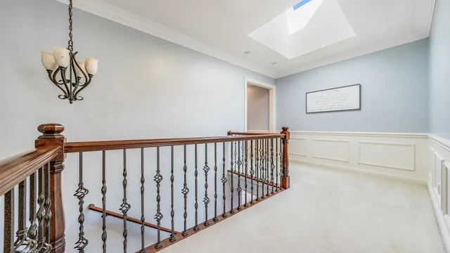a bathroom with a granite countertop sink toilet mirror and a shower
