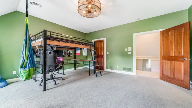 an aerial view of a house with a yard