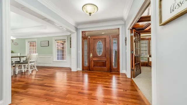 a living room with furniture a ceiling fan and a window