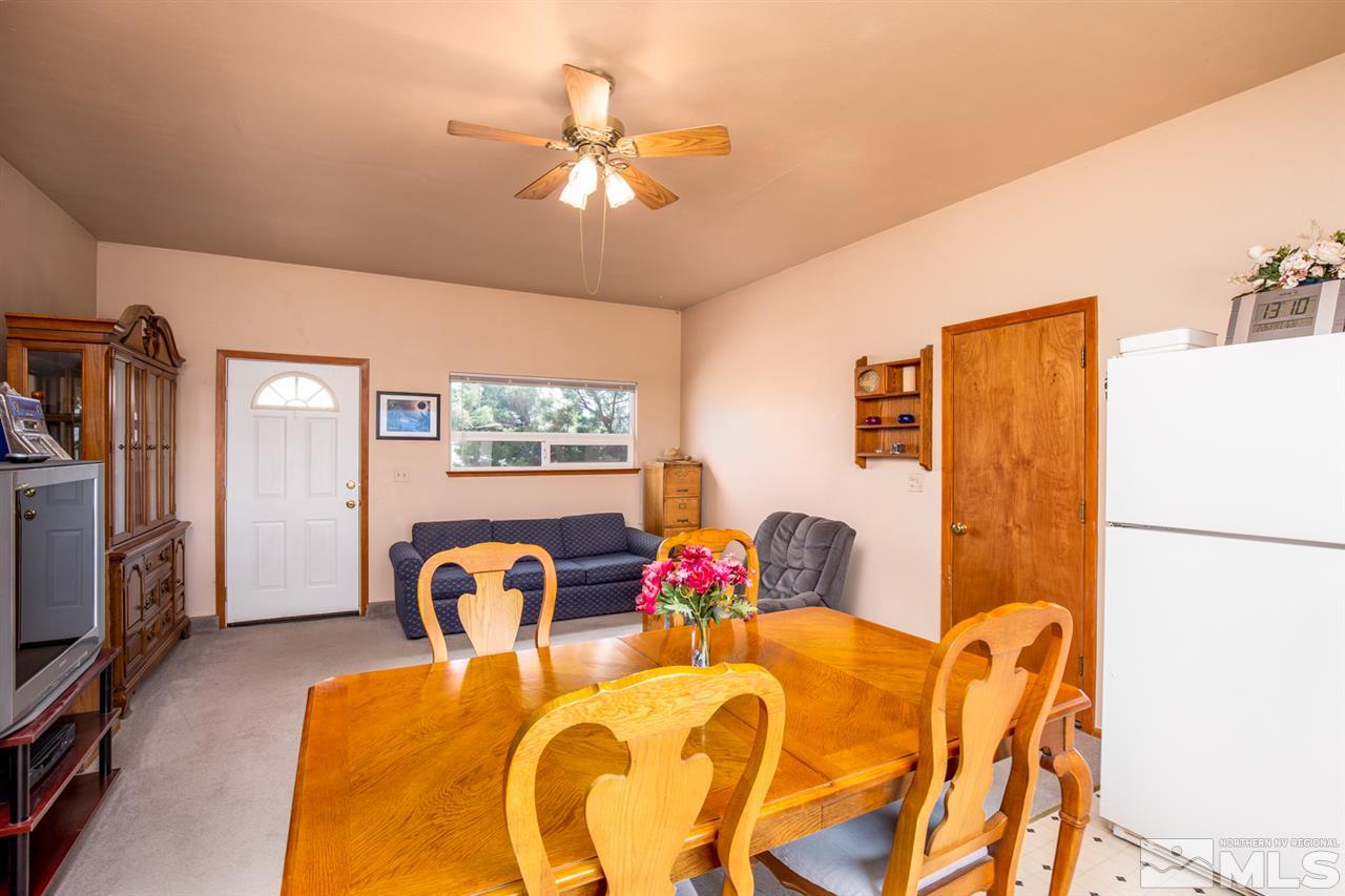 1719 Sunrise Pass Road Minden, NV 89423 - Photo 15 of 39 a view of a dining room with furniture and chandelier