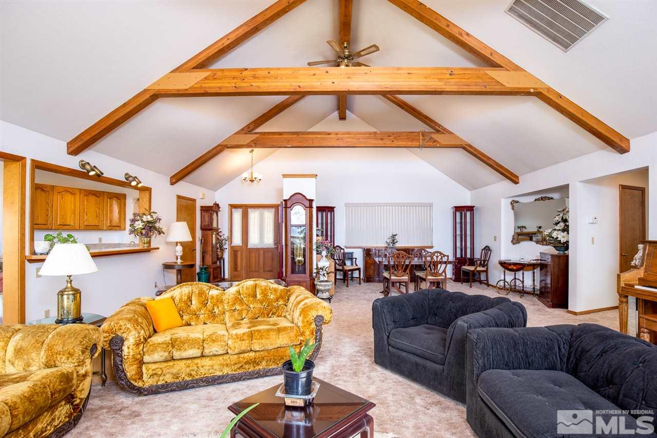 1719 Sunrise Pass Road Minden, NV 89423 - Photo 19 of 39 a living room with furniture and a large window