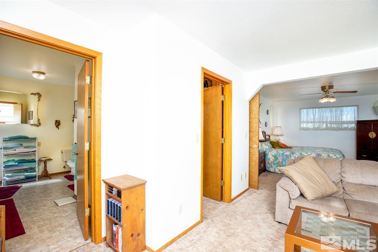 1719 Sunrise Pass Road Minden, NV 89423 - Photo 21 of 39 a living room with furniture and a table