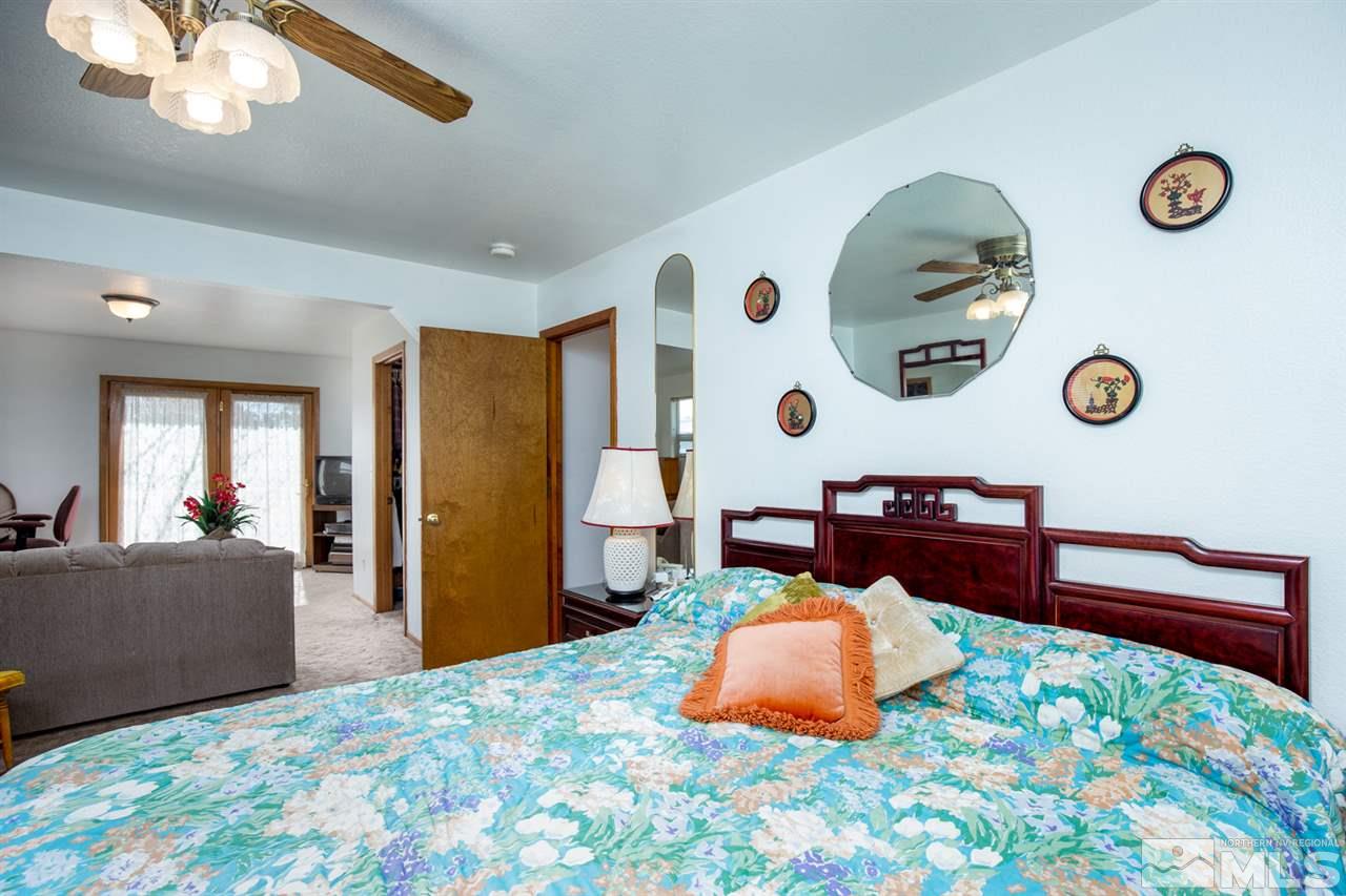 1719 Sunrise Pass Road Minden, NV 89423 - Photo 22 of 39 a bedroom with a bed and a table