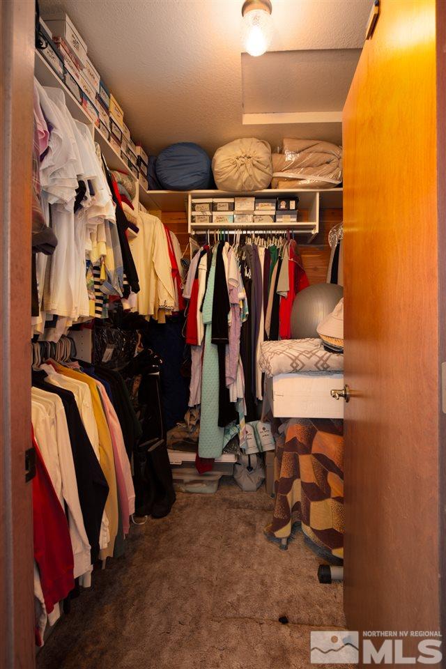 1719 Sunrise Pass Road Minden, NV 89423 - Photo 23 of 39 a view of walk in closet with clothes and shoes