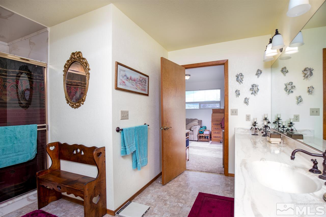 1719 Sunrise Pass Road Minden, NV 89423 - Photo 25 of 39 a bedroom with furniture and a mirror