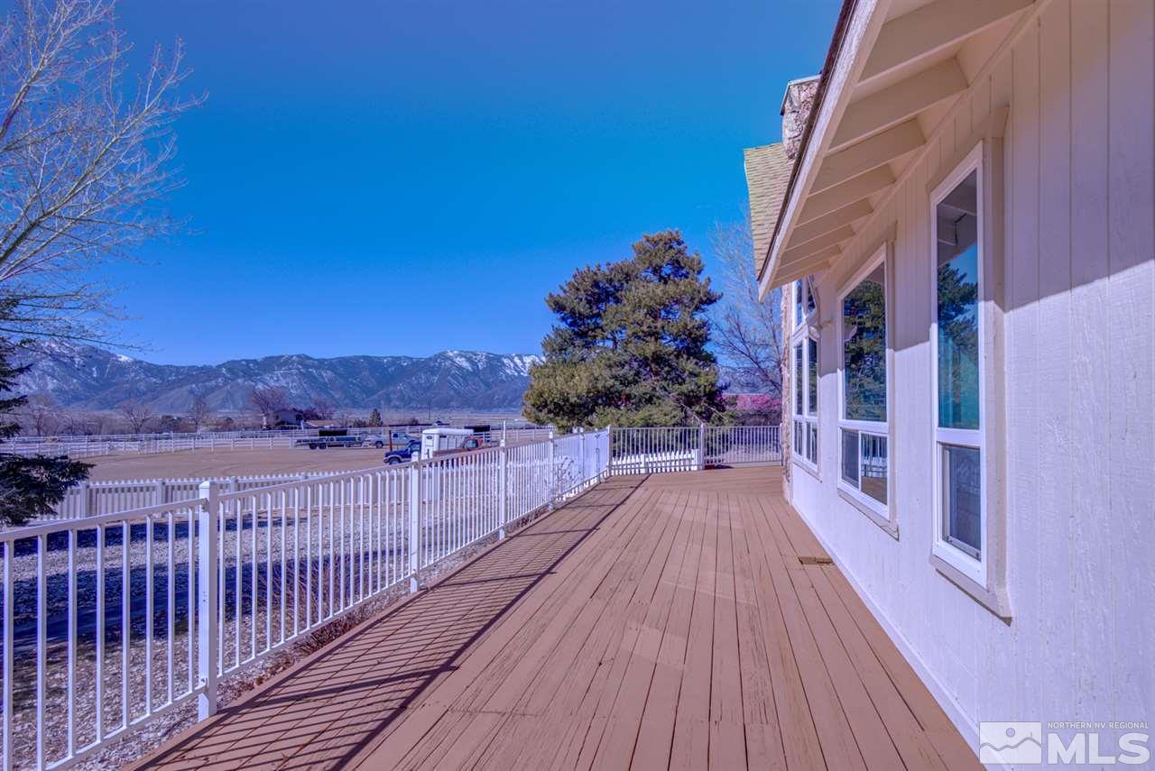 1719 Sunrise Pass Road Minden, NV 89423 - Photo 29 of 39 a view of a balcony with wooden floor and a potted plant