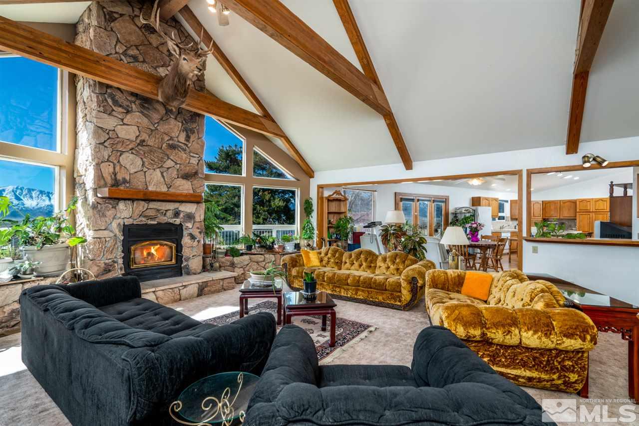 1719 Sunrise Pass Road Minden, NV 89423 - Photo 3 of 39 a living room with furniture and a fireplace