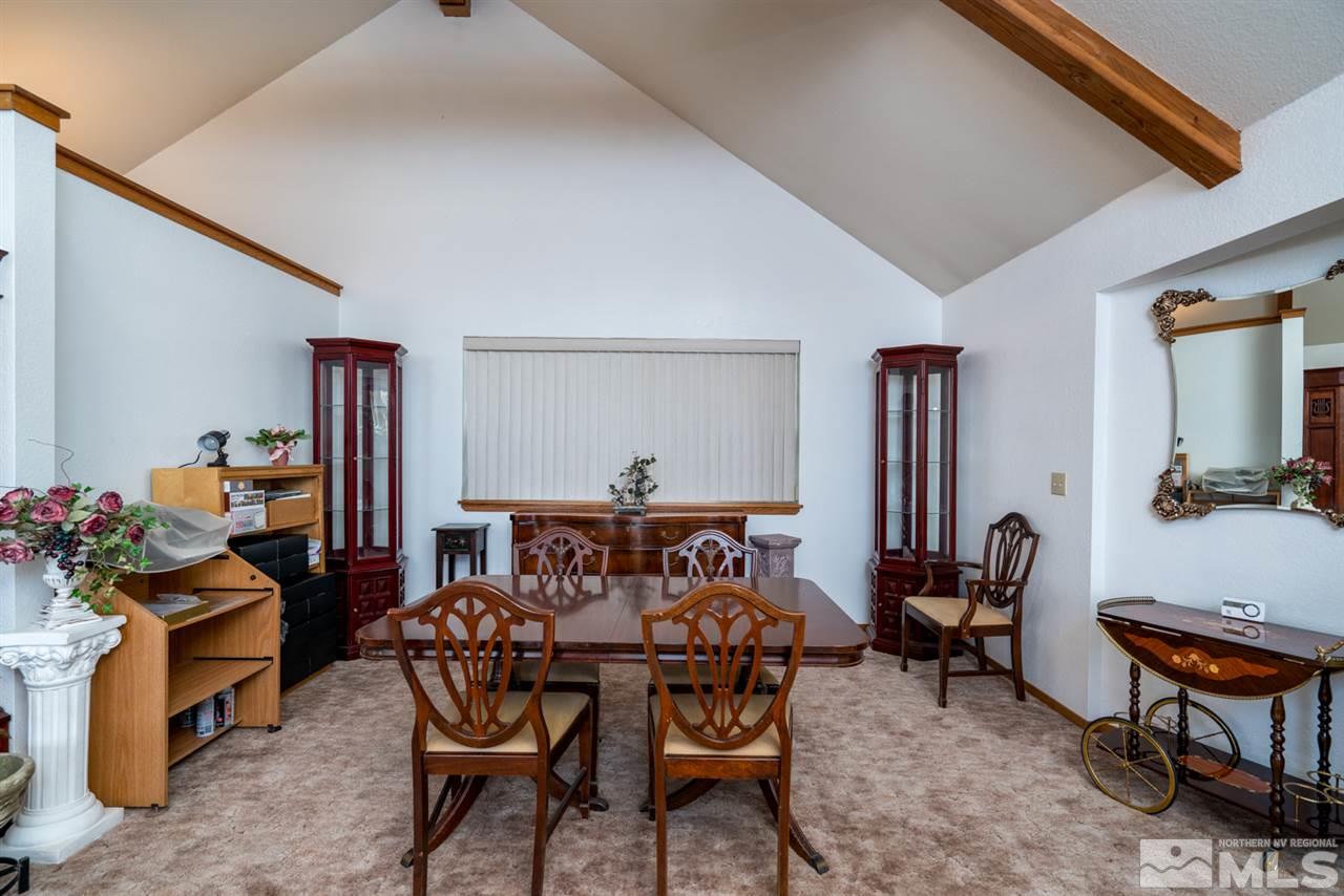 1719 Sunrise Pass Road Minden, NV 89423 - Photo 4 of 39 a living room with furniture and a window