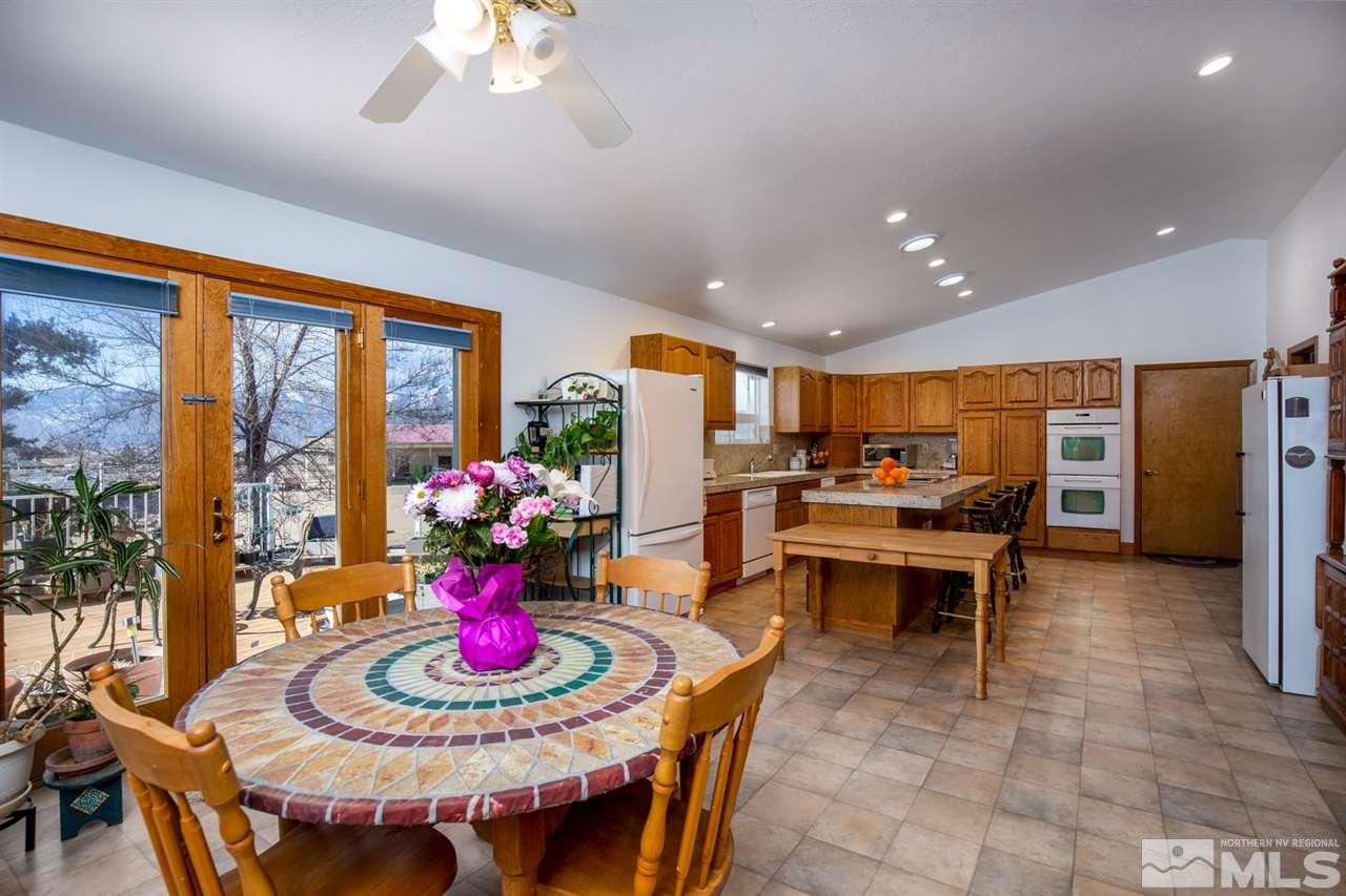 1719 Sunrise Pass Road Minden, NV 89423 - Photo 6 of 39 a view of a dining room with furniture window and outside view