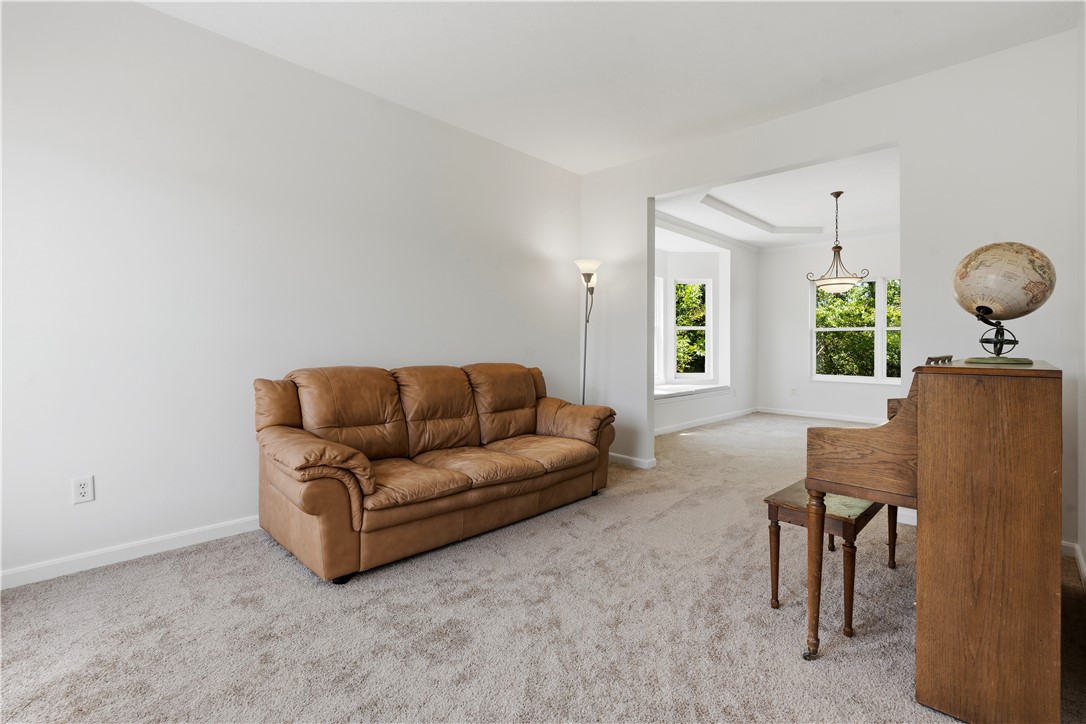 70 Martin Lane Springboro, OH 45066 - Photo 8 of 69 This bright living space features a welcoming layout, plush carpet, and ample natural light through large windows.