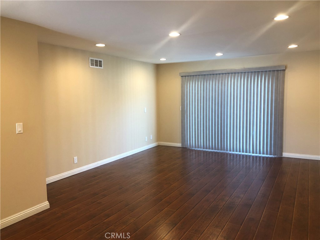 1881 Mitchell Avenue, Unit 51 Tustin, CA 92780 - Photo 8 of 22 a view of a livingroom with wooden floor