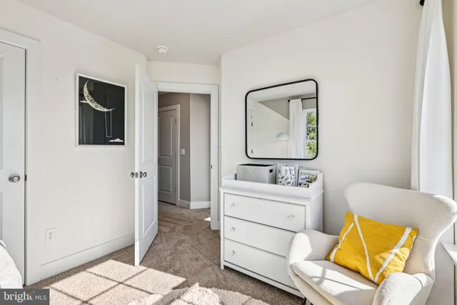 a room with a sink and a mirror