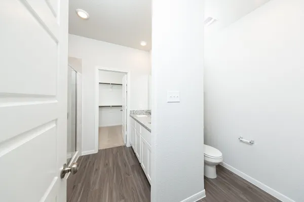 a bathroom with a toilet and a sink