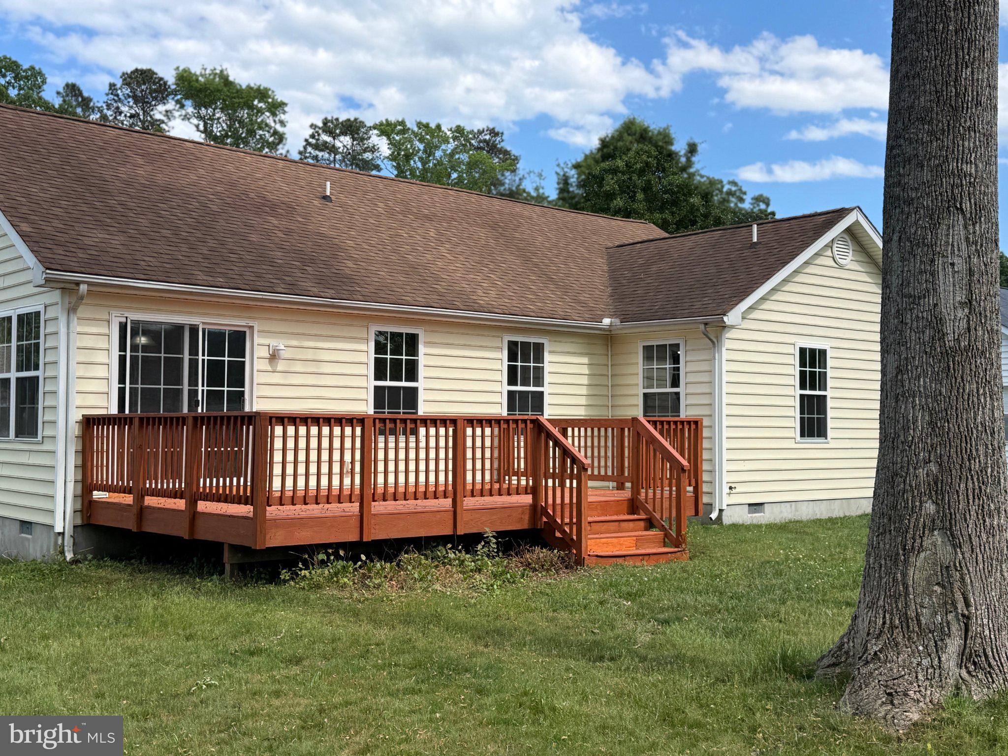 30952 Sandy Ridge Drive Lewes, DE 19958 - Photo 2 of 17 a view of backyard with deck