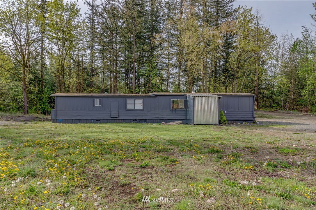 2073 East Pole Road Everson, WA 98247 - Photo 2 of 18 a wooden fence in front of a house