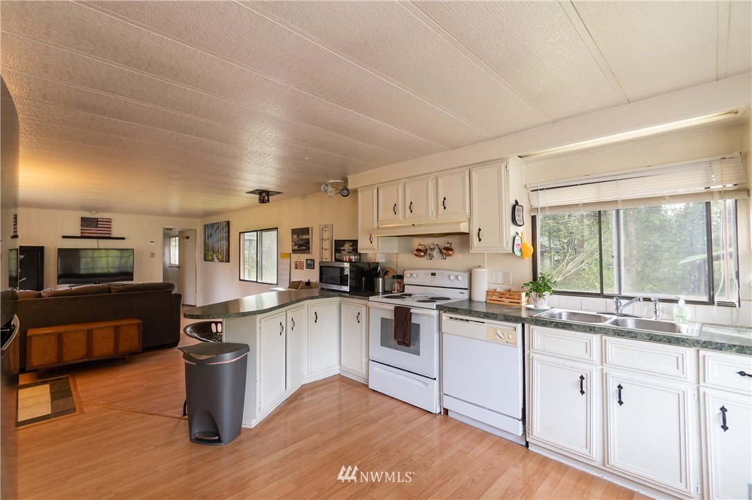 2073 East Pole Road Everson, WA 98247 - Photo 12 of 18 a kitchen with white cabinets and appliances