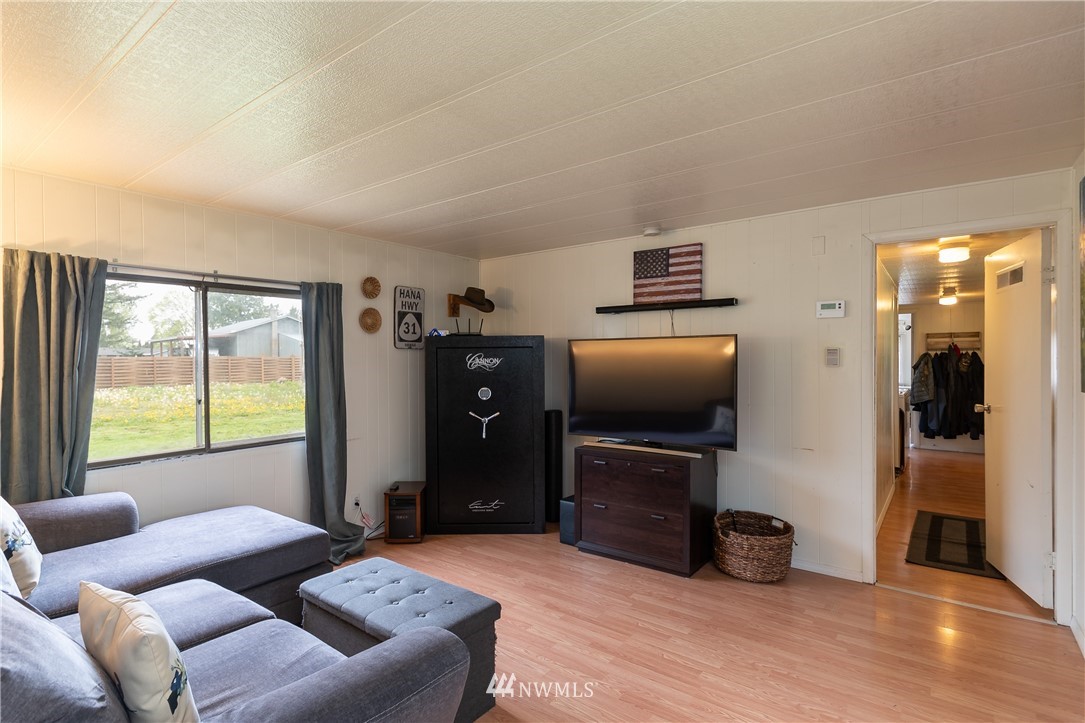 2073 East Pole Road Everson, WA 98247 - Photo 13 of 18 a living room with furniture and a flat screen tv