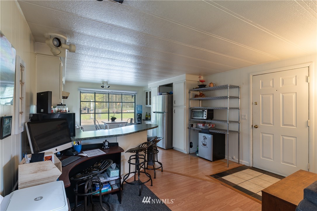 2073 East Pole Road Everson, WA 98247 - Photo 14 of 18 a view of a workspace with furniture and a window