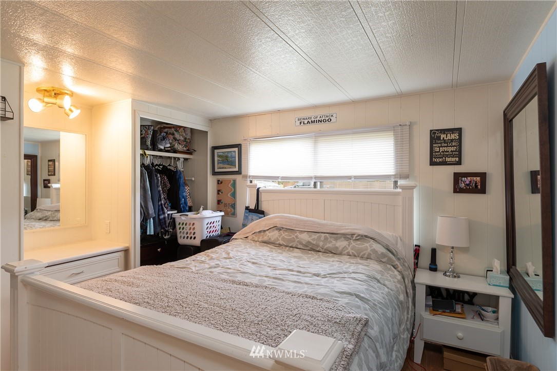 2073 East Pole Road Everson, WA 98247 - Photo 15 of 18 a bedroom with a bed and a view of living room