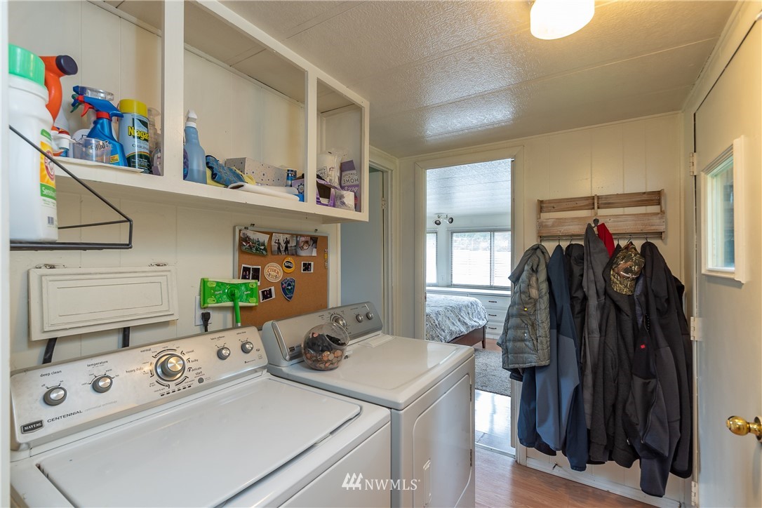 2073 East Pole Road Everson, WA 98247 - Photo 16 of 18 a view of walk in closet with clothes and shoes