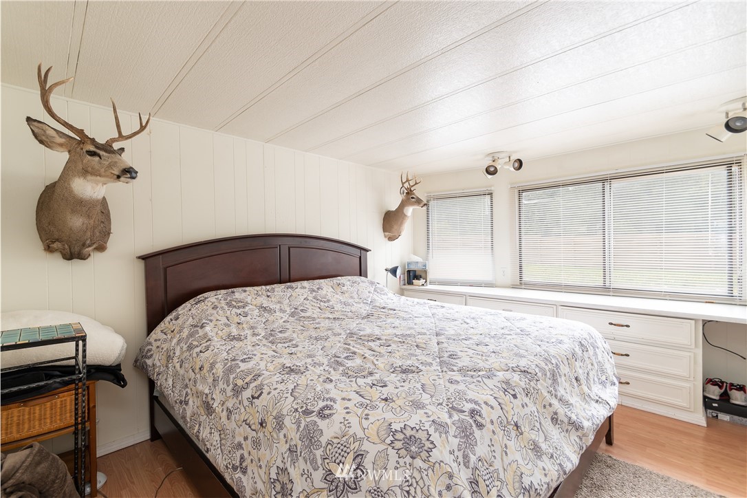2073 East Pole Road Everson, WA 98247 - Photo 18 of 18 a bedroom with a bed and wooden floor