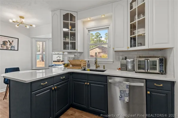 a kitchen with a sink and cabinets