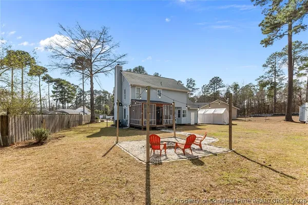 an aerial view of a house with swimming pool and sitting space