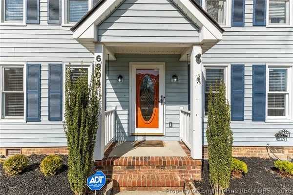 a front view of a house with a porch