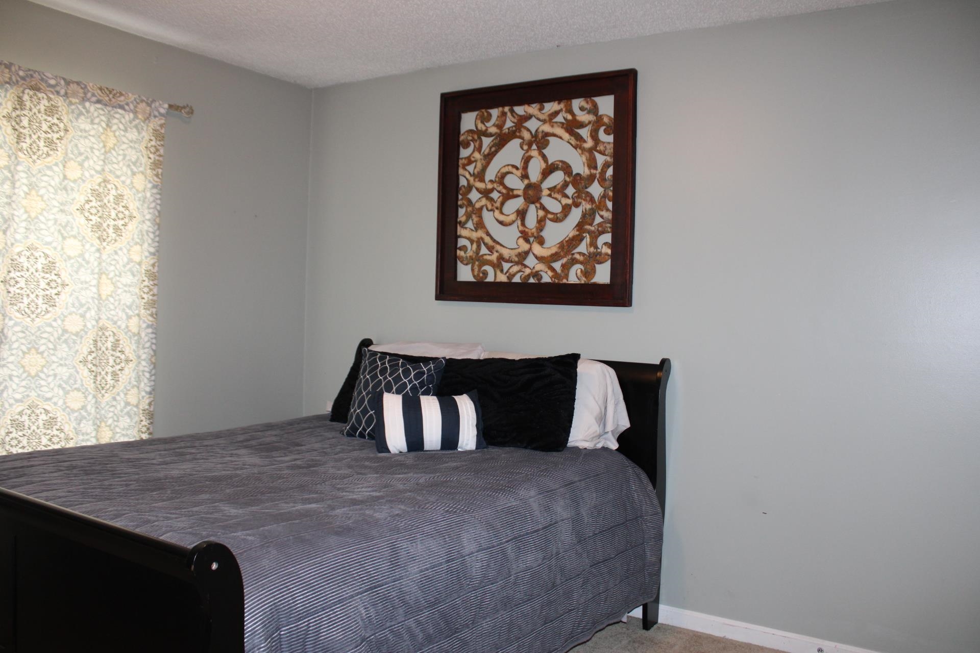 64 Buck Stand Road Atoka, TN 38004 - Photo 24 of 39 a bedroom with a bed and a window