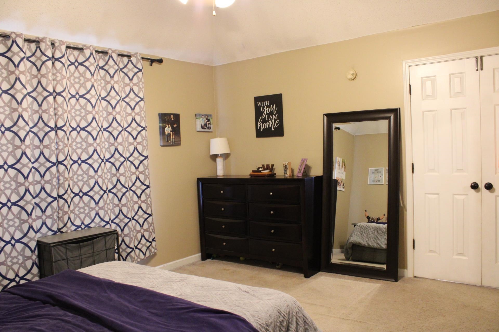 64 Buck Stand Road Atoka, TN 38004 - Photo 28 of 39 a bedroom with a bed and a dresser