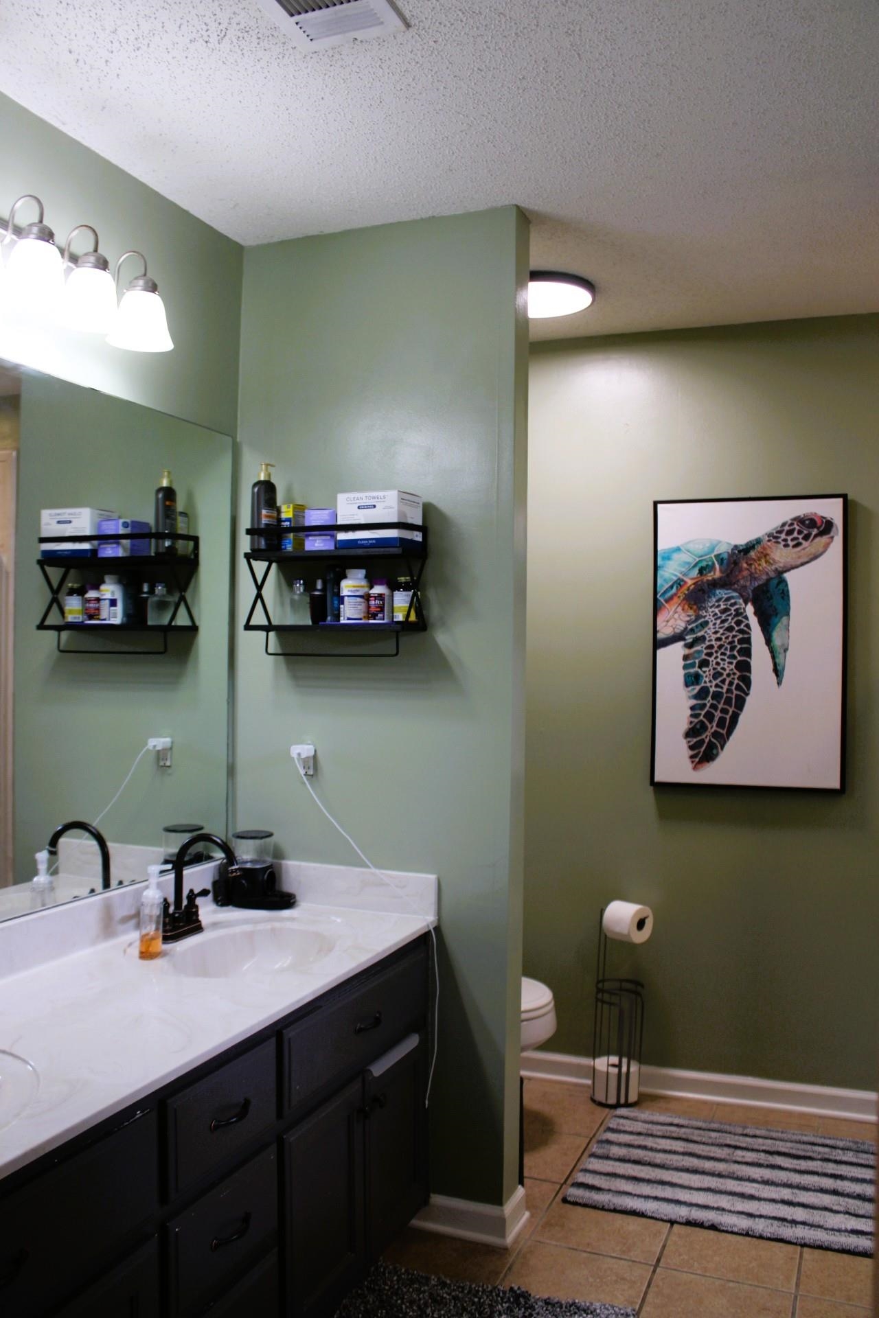 64 Buck Stand Road Atoka, TN 38004 - Photo 30 of 39 a bathroom with a sink and mirror