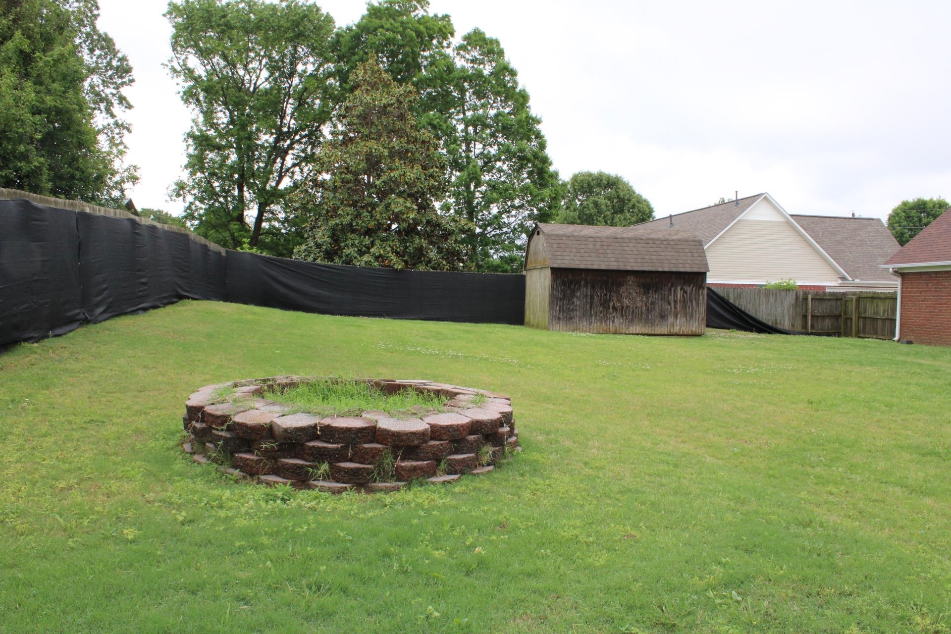 64 Buck Stand Road Atoka, TN 38004 - Photo 37 of 39 a view of a house with backyard and a tree