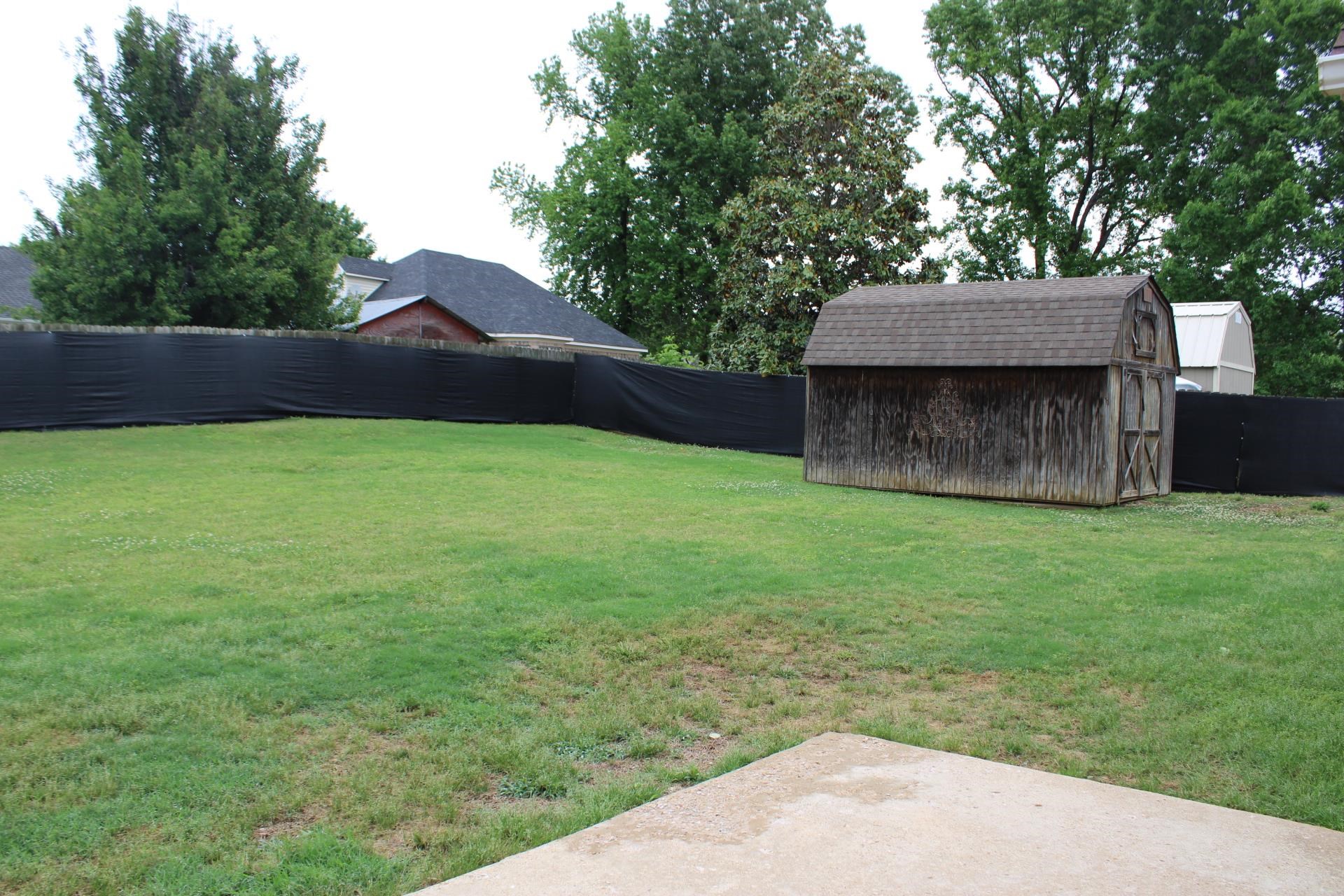 64 Buck Stand Road Atoka, TN 38004 - Photo 39 of 39 a backyard of a house with lots of green space