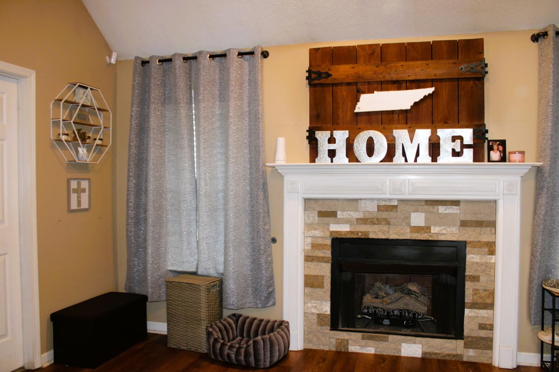 64 Buck Stand Road Atoka, TN 38004 - Photo 9 of 39 a living room with furniture and a fireplace