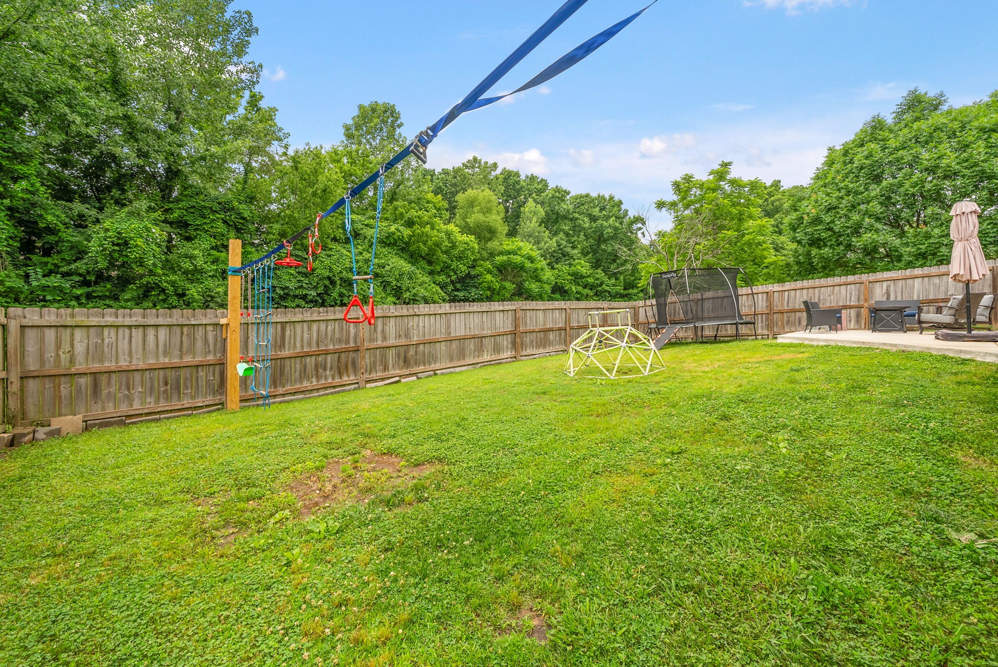 1161 Cynthia Lane Spring Hill, TN 37174 - Photo 35 of 42 a view of a backyard with a garden and plants