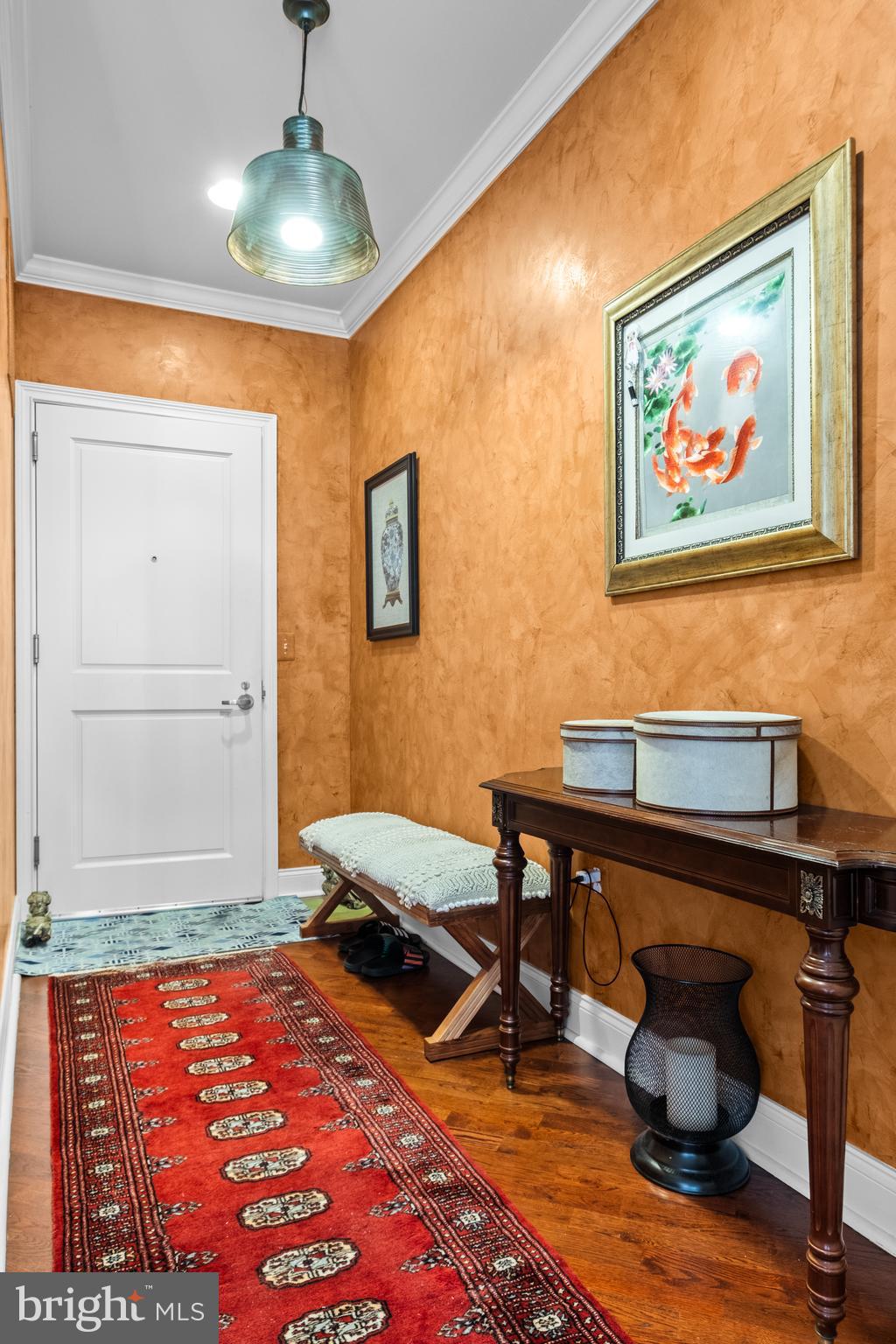 600 Commodore Court, Unit 2631 Philadelphia, PA 19146 - Photo 18 of 45 a bedroom with a bed and a chandelier