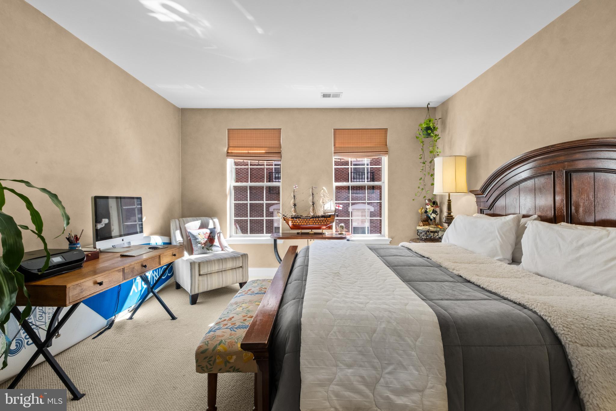 600 Commodore Court, Unit 2631 Philadelphia, PA 19146 - Photo 19 of 45 a bedroom with a bed a couch and a window