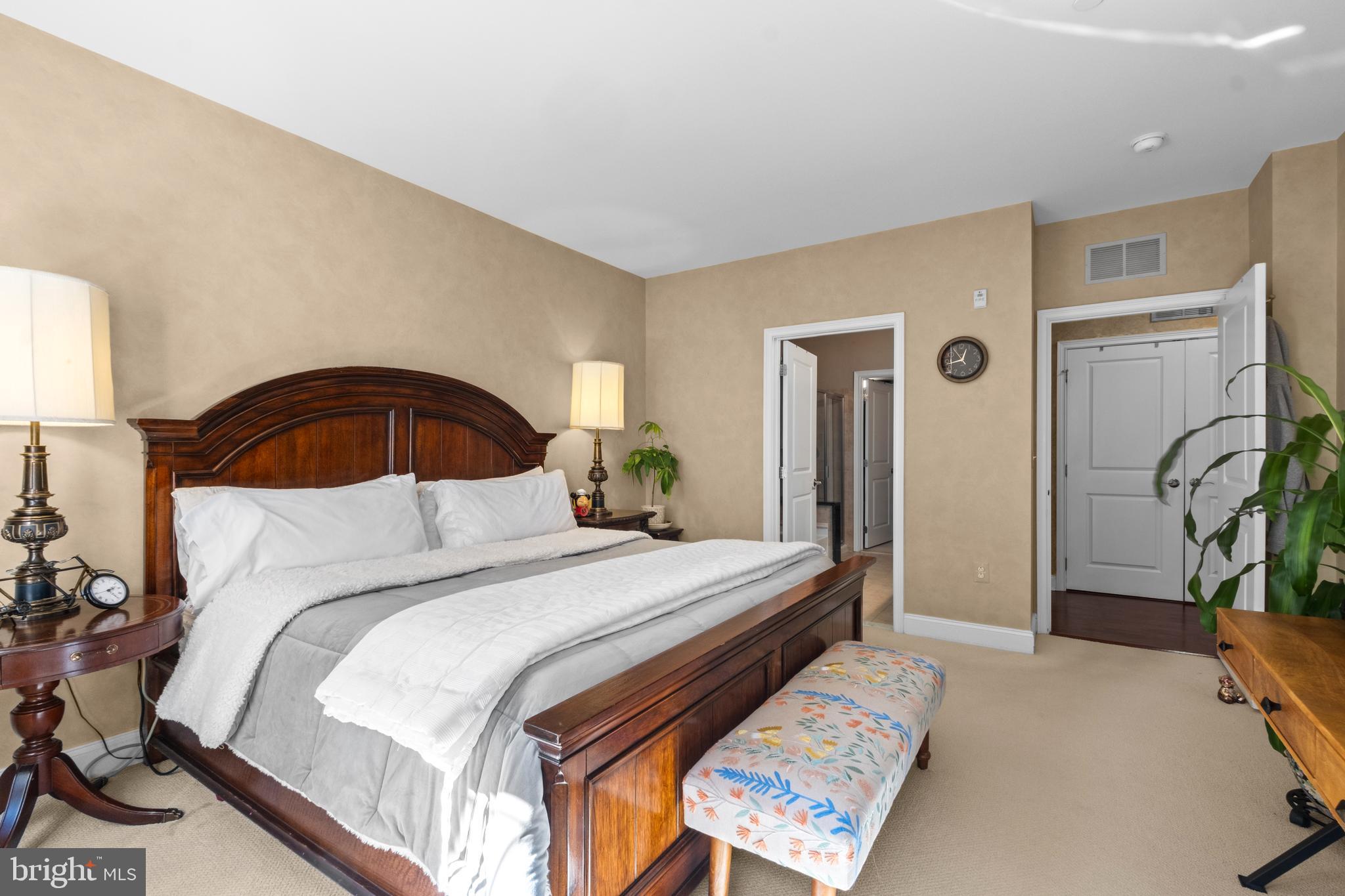 600 Commodore Court, Unit 2631 Philadelphia, PA 19146 - Photo 20 of 45 a bedroom with a bed and a potted plant