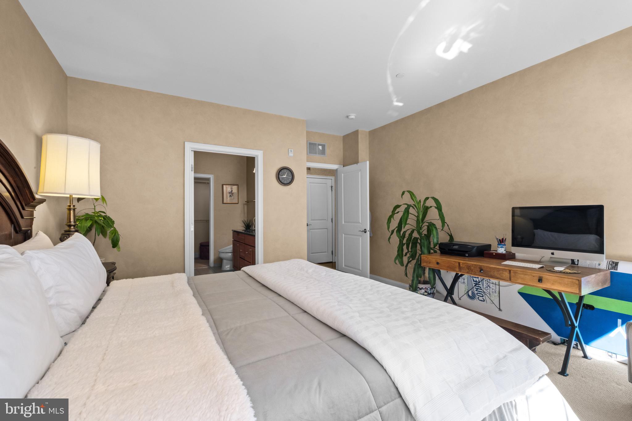 600 Commodore Court, Unit 2631 Philadelphia, PA 19146 - Photo 21 of 45 a bedroom with a bed and a flat screen tv