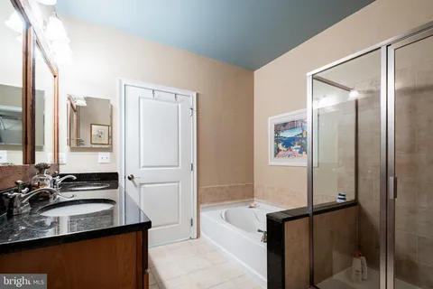 a kitchen with a refrigerator and a sink