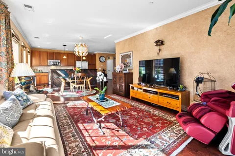 a living room with lots of furniture and a flat screen tv
