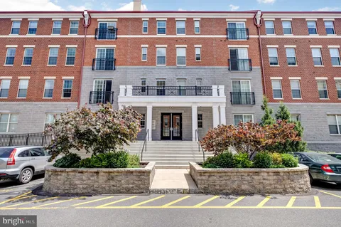 a front view of a building with garden