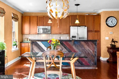 a view of a dining room with furniture and a table