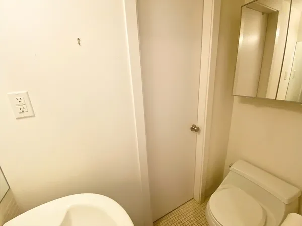 a bathroom with a toilet and a sink