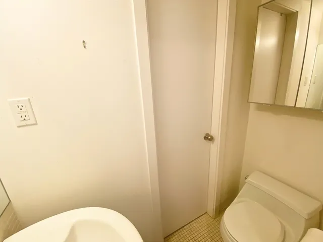 a bathroom with a toilet and a sink