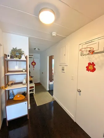 a view of a hallway with bathroom
