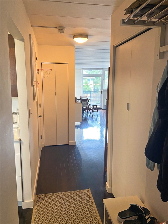 345 Harvard Street, Unit U1F Cambridge, MA 02138 - Photo 14 of 19 a view of livingroom with furniture and wooden floor