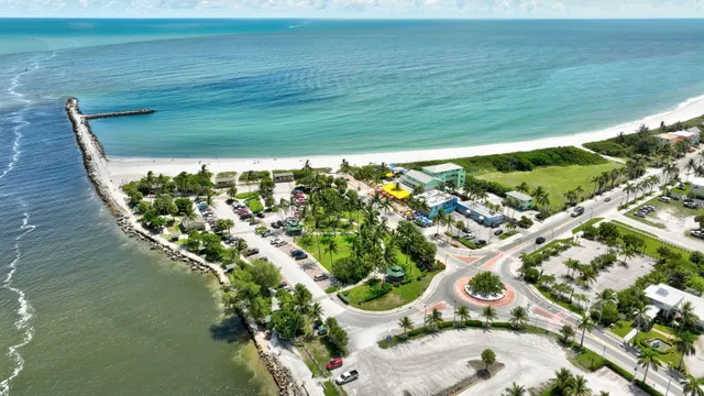 an aerial view of a residential houses with outdoor space